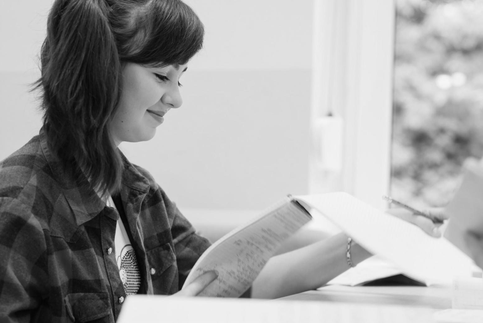 Financial analysis workspace with detailed research materials